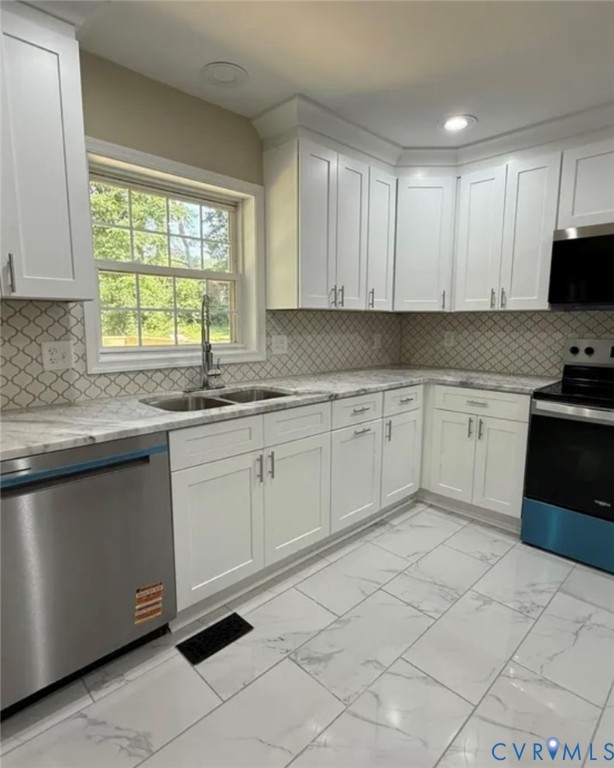 18820 Kerill Road Triangle, VA 22172 - Photo 3 of 8 a kitchen with a sink window and cabinets