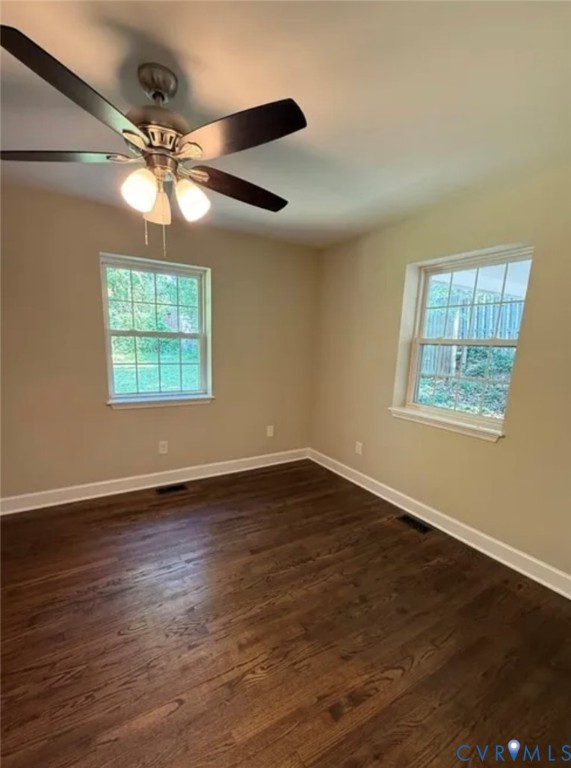 18820 Kerill Road Triangle, VA 22172 - Photo 6 of 8 a view of an empty room with wooden floor and a window