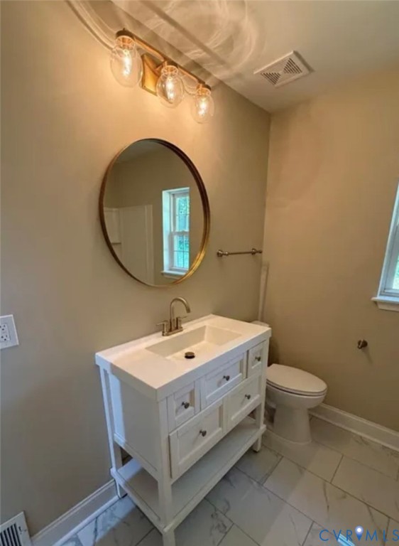 18820 Kerill Road Triangle, VA 22172 - Photo 7 of 8 a bathroom with a sink mirror and toilet