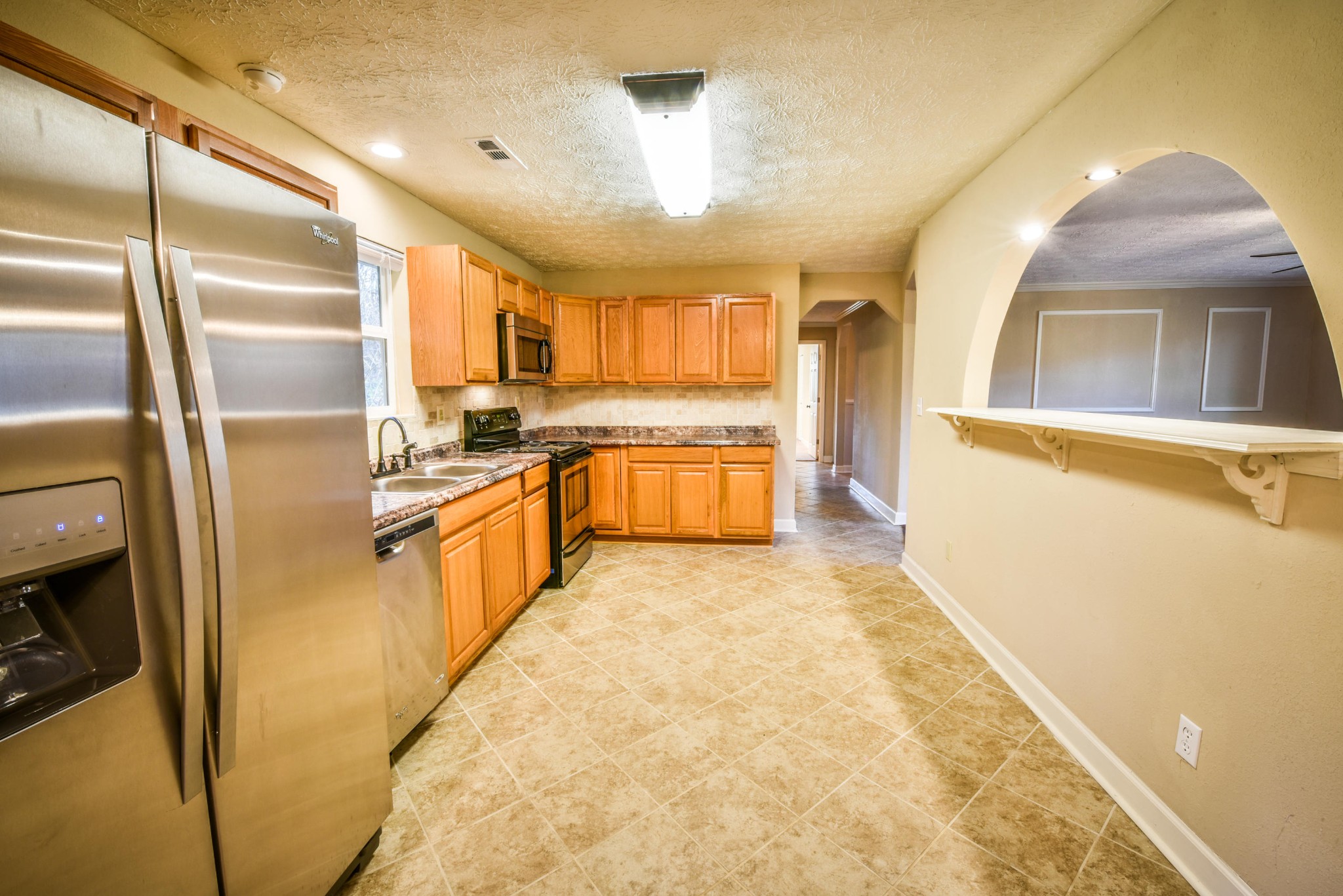3984 Bent Road Kodak, TN 37764 - Photo 12 of 21 a kitchen with stainless steel appliances granite countertop a refrigerator a oven and white cabinets