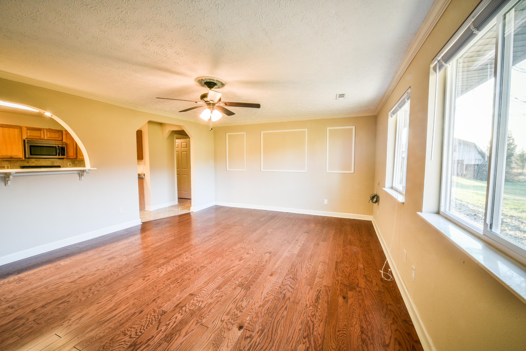 3984 Bent Road Kodak, TN 37764 - Photo 8 of 21 a view of an empty room with a window and wooden floor