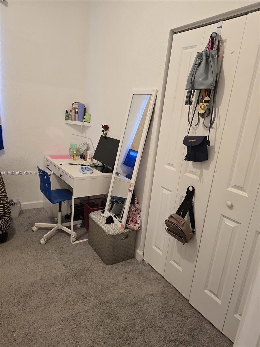 18264 Southwest 148th Road, Unit 18264 Miami, FL 33187 - Photo 11 of 25 a view of a workspace with furniture