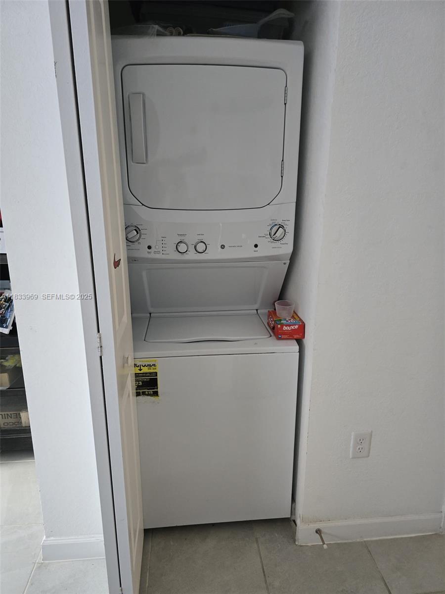 18264 Southwest 148th Road, Unit 18264 Miami, FL 33187 - Photo 21 of 25 a utility room with dryer and washer