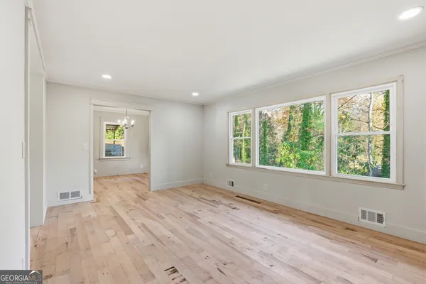 a view of an empty room with a window