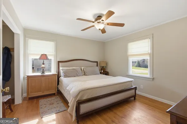 a bedroom with a large bed and a window
