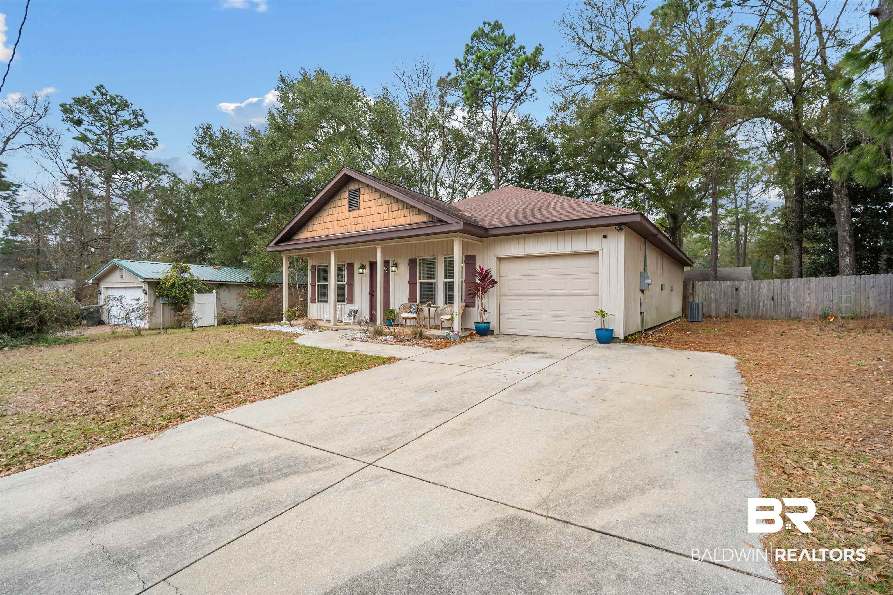 209 Maplewood Loop Daphne, AL 36526 - Photo 3 of 23 Single story home with a porch, a garage, driveway, and roof with shingles
