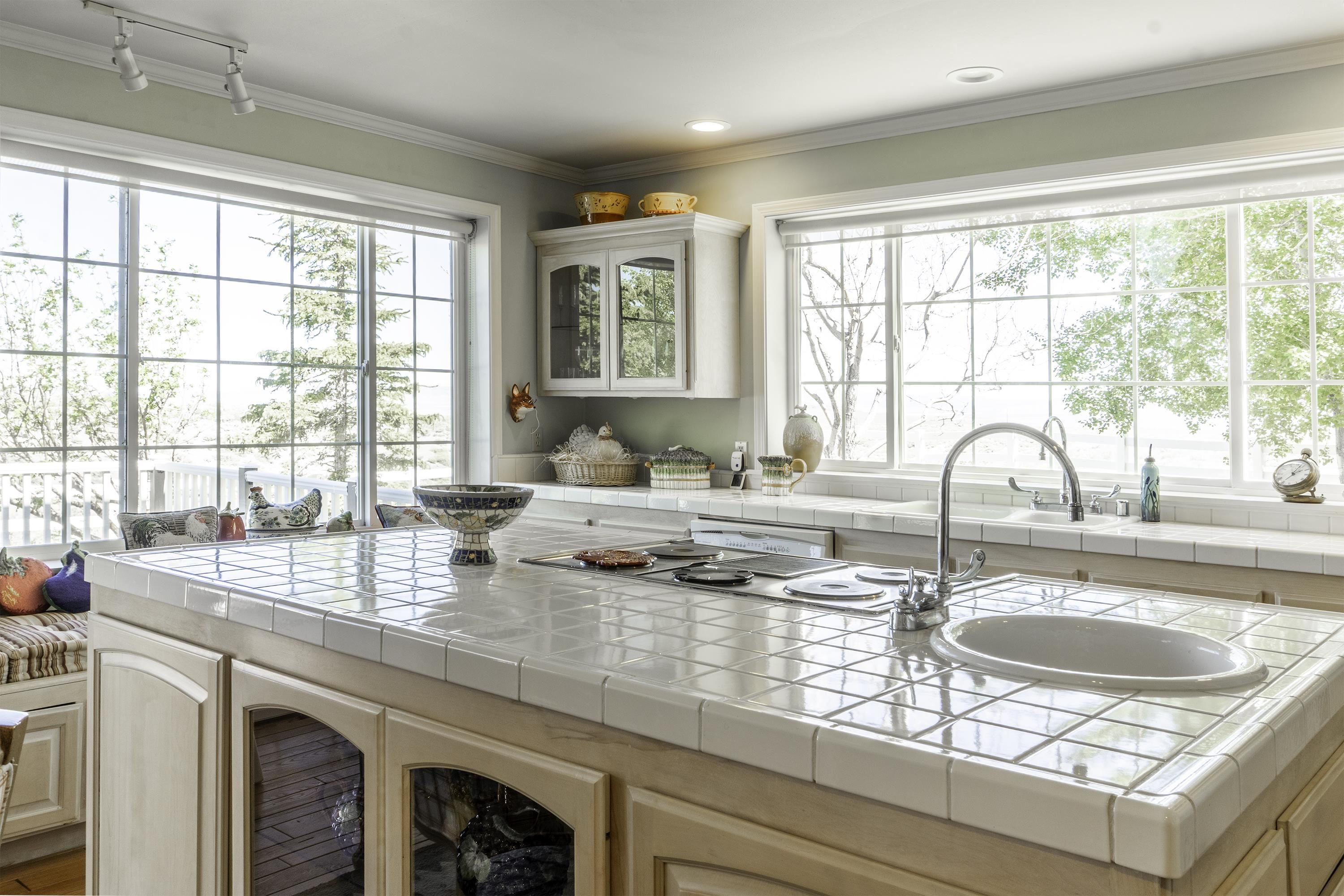 416 Wilson Creek Road Lee Vining, CA 93541 - Photo 22 of 64 a kitchen with granite countertop a sink and a window
