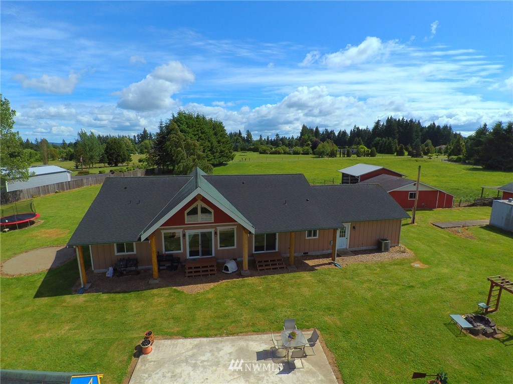 9302 Gastaeson Lane Southwest Rochester, WA 98579 - Photo 3 of 12 a aerial view of a house with garden