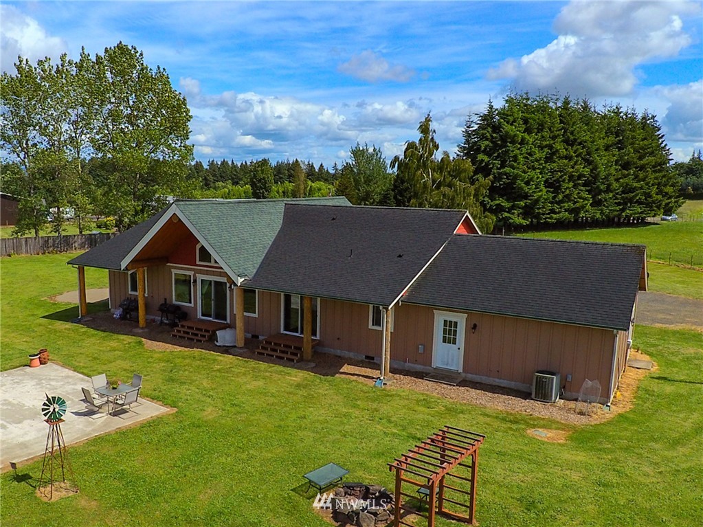 9302 Gastaeson Lane Southwest Rochester, WA 98579 - Photo 5 of 12 a aerial view of a house with a garden and plants