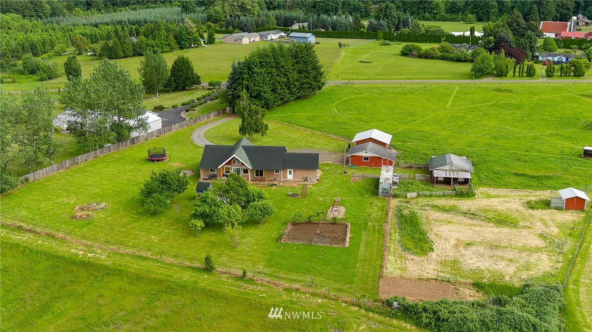 9302 Gastaeson Lane Southwest Rochester, WA 98579 - Photo 7 of 12 an aerial view of a house having yard