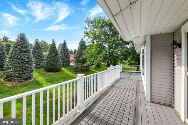 a view of a balcony with wooden floor
