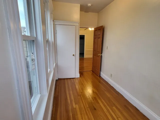 a view of entryway with wooden floor