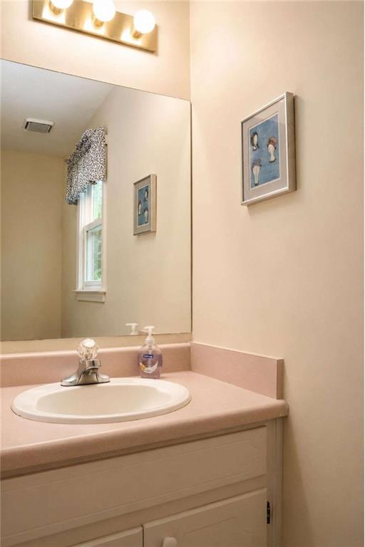 365 River Ridge Trail Oxford, GA 30054 - Photo 12 of 37 a bathroom with a sink and a mirror