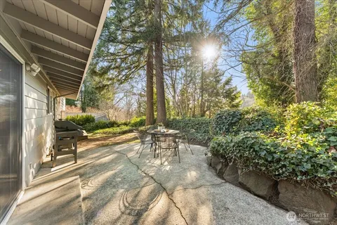 a view of a patio with table and chairs and potted plants