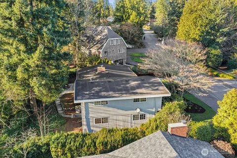 a aerial view of a house with a yard
