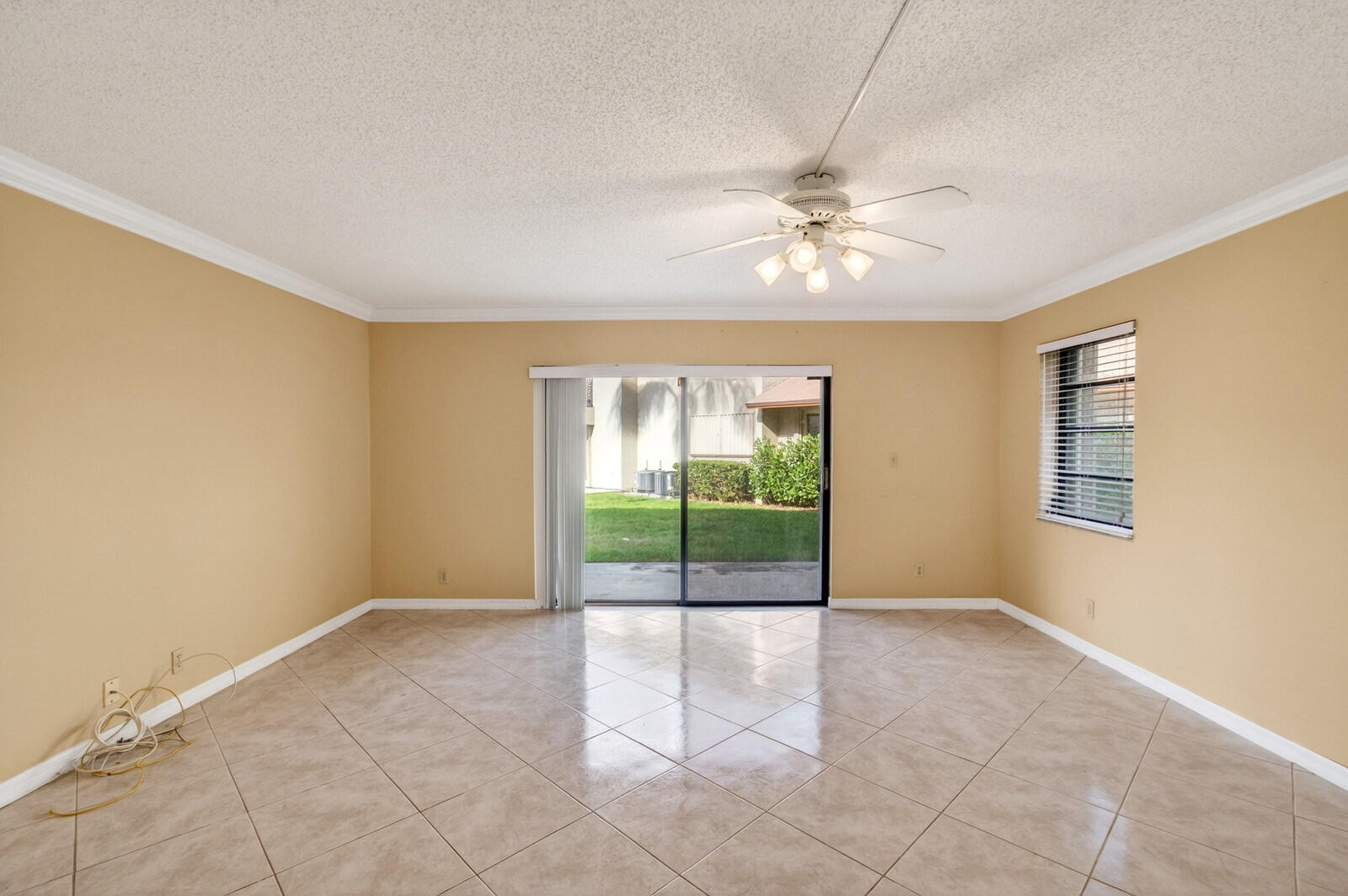 3951 Northeast 19th Road, Unit 1701 Pompano Beach, FL 33064 - Photo 25 of 82 an empty room with windows and ceiling fan