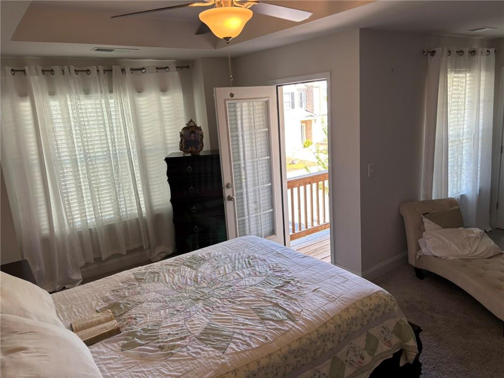 11208 Benton Loop Covington, GA 30014 - Photo 11 of 16 a bedroom with a bed and a window