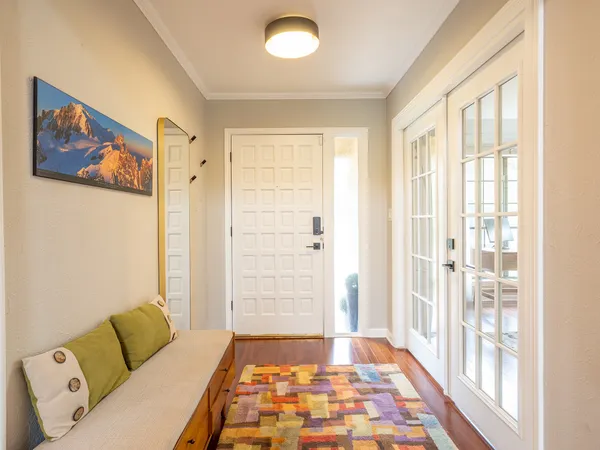 a living room with furniture and a rug