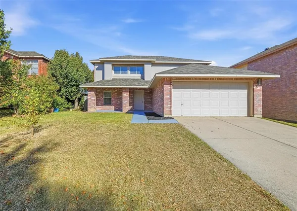 front view of a house with a yard