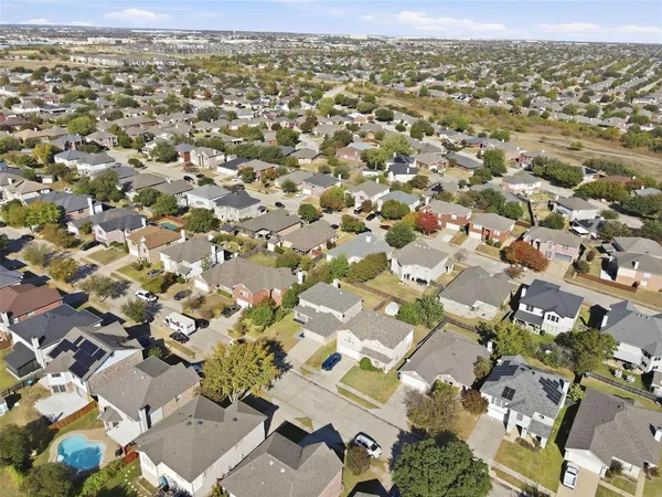 an aerial view of residential houses with outdoor space