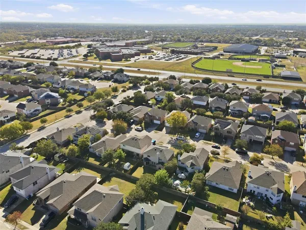 an aerial view of residential houses with outdoor space