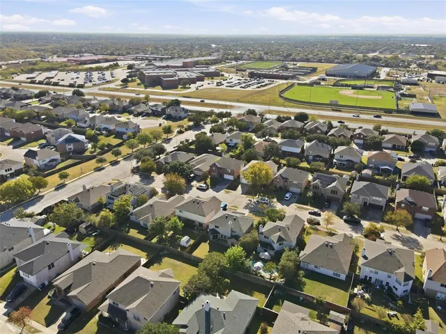 an aerial view of residential houses with outdoor space