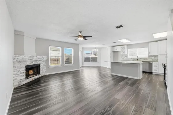 a view of kitchen with furniture and wooden floor