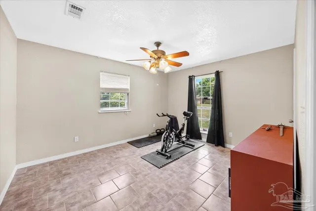a room with gym equipment and a window