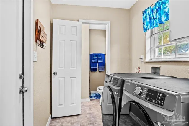 a view of kitchen with furniture and window