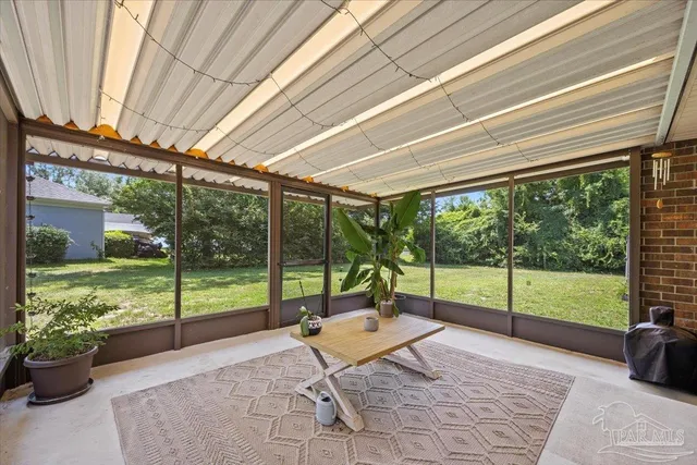 a view of a room with furniture and garden