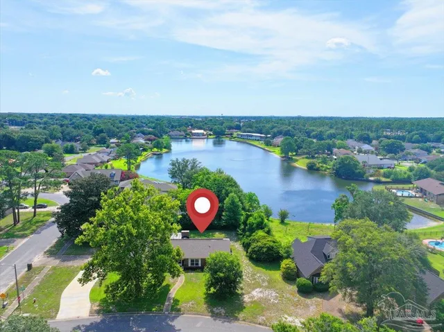 a view of a garden with plants and lake view