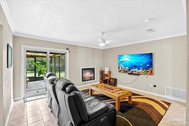 a bedroom with furniture and a flat screen tv