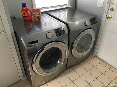 a utility room with dryer and washer