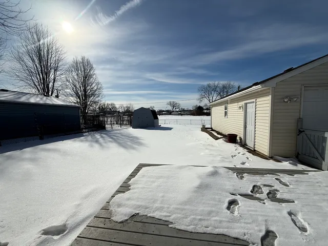 a view of a backyard of snow