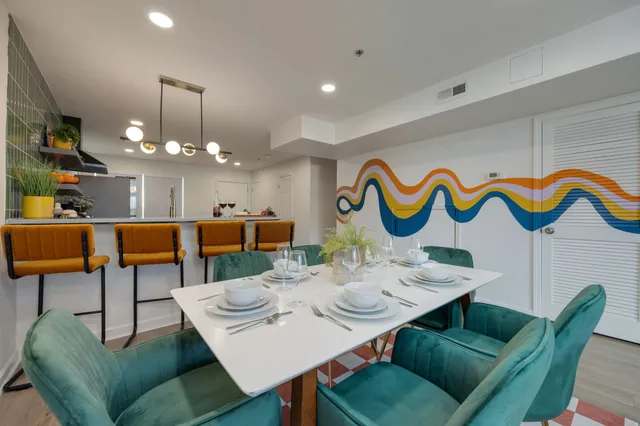 a dining room with a table and chairs