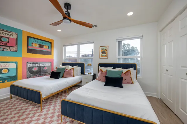 a bedroom with a bed and window