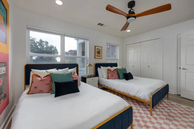 a bedroom with a bed and a fireplace