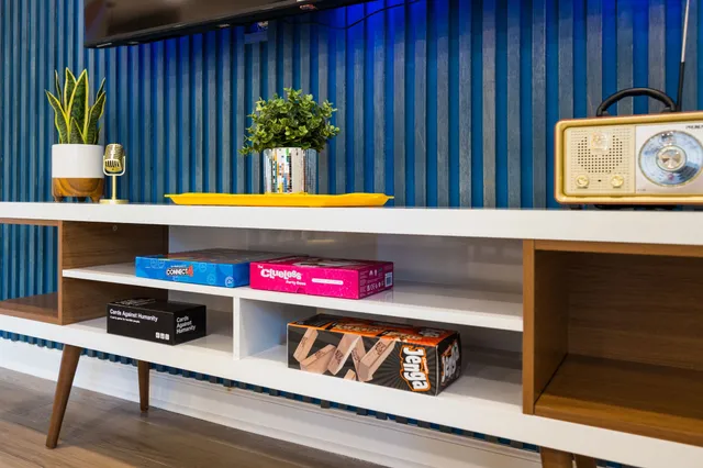 a kitchen with a stove and a potted plant
