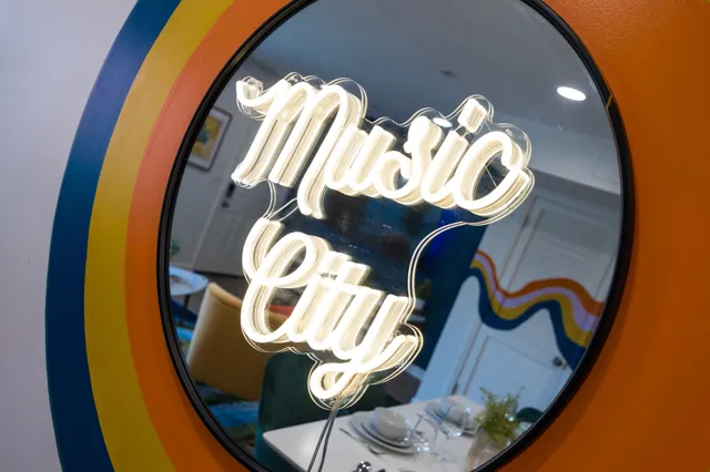a view of staircase with rug and wooden floor