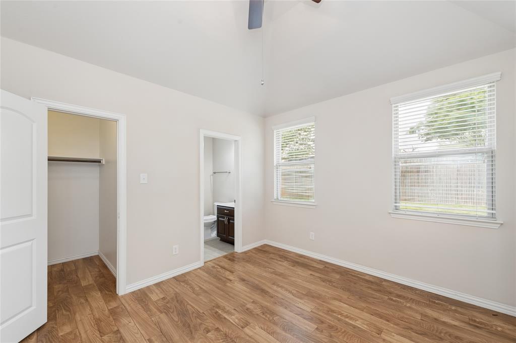 12571 Valley Spring Drive Frisco, TX 75035 - Photo 16 of 39 a view of an empty room with wooden floor and a window