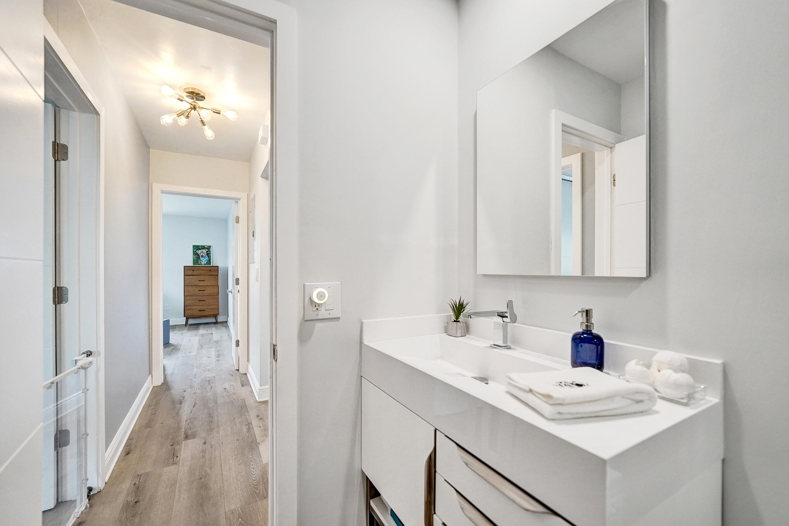381 Southeast 3rd Street Pompano Beach, FL 33060 - Photo 22 of 41 a bathroom with a sink vanity and mirror
