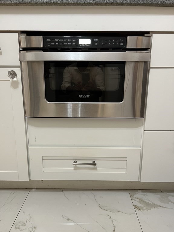 24-26 Inman Street, Unit 28 Lawrence, MA 01843 - Photo 7 of 13 a close view of a stove