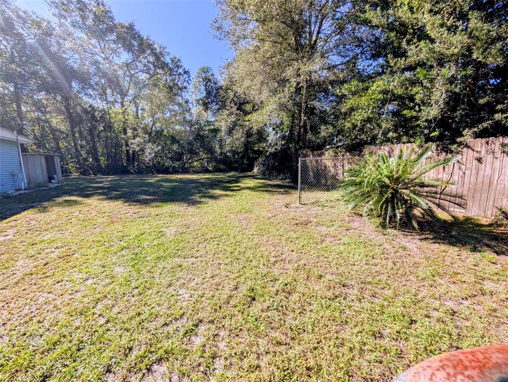 20422 Canvas Back Road Altoona, FL 32702 - Photo 2 of 24 a view of a swimming pool with an outdoor space and seating area