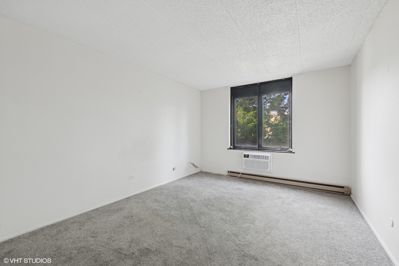 9701 North Dee Road, Unit 2I Niles, IL 60714 - Photo 12 of 24 an empty room with a window