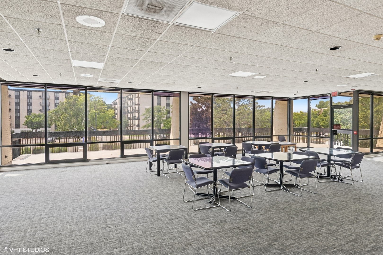 9701 North Dee Road, Unit 2I Niles, IL 60714 - Photo 16 of 24 a living room with furniture and a large window