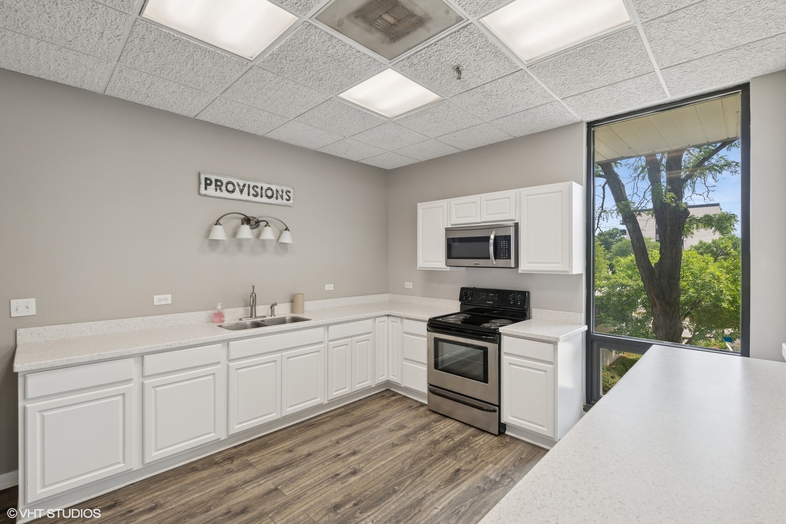 9701 North Dee Road, Unit 2I Niles, IL 60714 - Photo 19 of 24 a kitchen with a sink appliances and cabinets