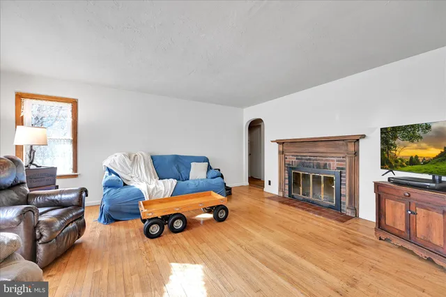 a view of a livingroom with furniture and a fireplace