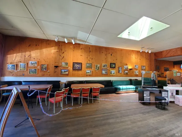 a dinning table and chairs in a room