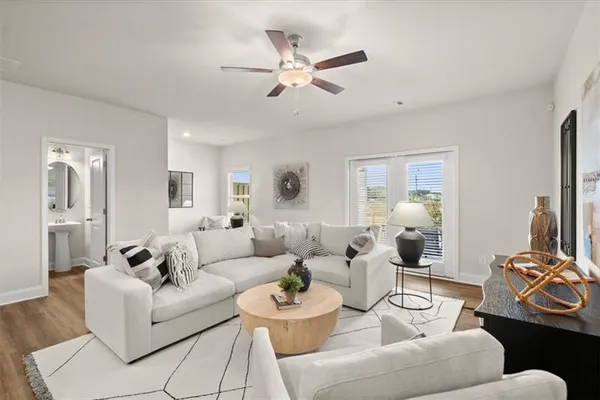 a living room with furniture and a large window