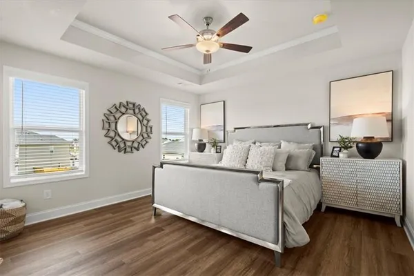 a living room with bed and a window